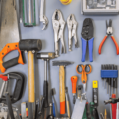 Collection_of_tools_including_pliers_hammers_and_screwdriver
